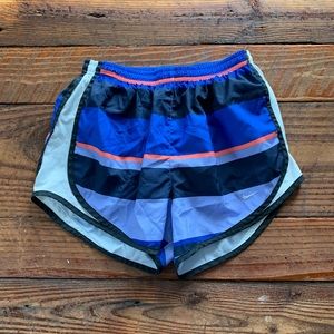 Purple and pink nike shorts